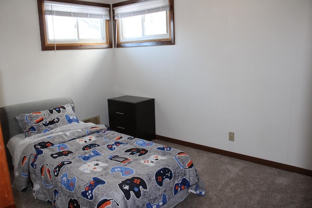 unfurnished bedroom with carpet flooring and baseboards