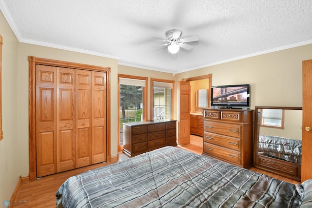 bedroom featuring a textured ceiling, crown molding, and wood finished floors