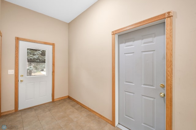 entryway featuring baseboards