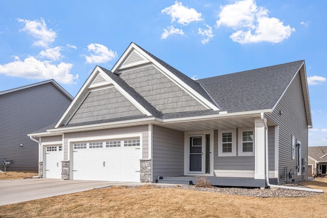 9764 Saint Andrews Dr, Elko New Market, MN 55020 - craftsman inspired home with an attached garage, concrete driveway, roof with shingles, covered porch, and a front yard