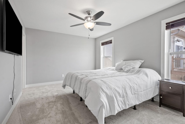 9764 Saint Andrews Dr, Elko New Market, MN 55020 - bedroom with light carpet, multiple windows, baseboards, and a ceiling fan