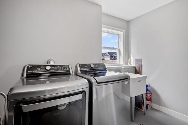 9764 Saint Andrews Dr, Elko New Market, MN 55020 - washroom with washing machine and dryer and baseboards