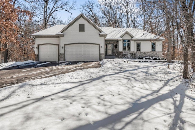 view of front of home with brick siding and an attached garage