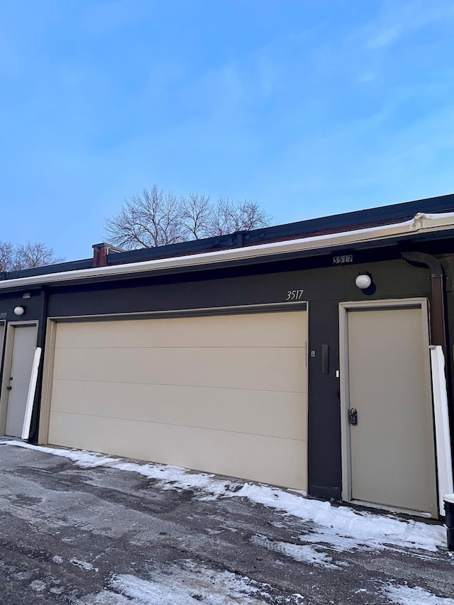 view of snow covered garage