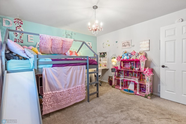 bedroom featuring carpet and a chandelier