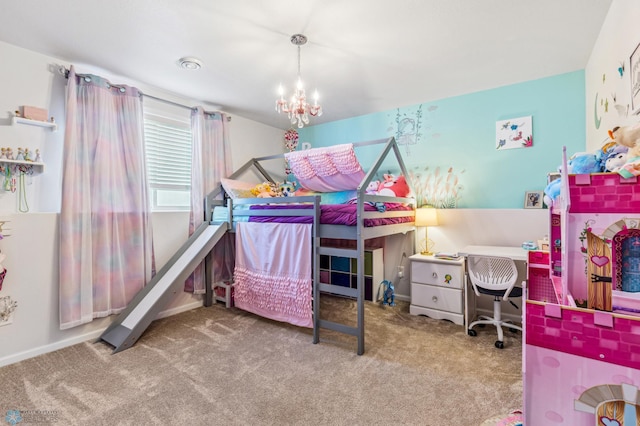 carpeted bedroom featuring baseboards and a notable chandelier