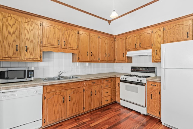 3879 Polk St NE, Columbia Heights, MN 55421 - kitchen with white appliances, under cabinet range hood, brown cabinets, a sink, and dark wood-type flooring