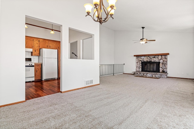 3879 Polk St NE, Columbia Heights, MN 55421 - unfurnished living room with a fireplace, visible vents, dark carpet, baseboards, and ceiling fan with notable chandelier