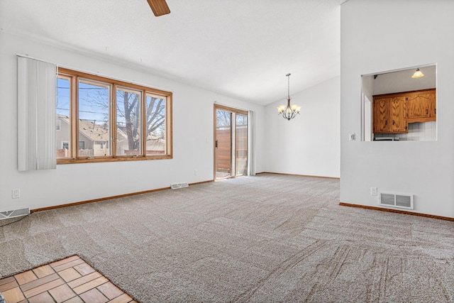 3879 Polk St NE, Columbia Heights, MN 55421 - unfurnished living room featuring visible vents, ceiling fan with notable chandelier, lofted ceiling, and light colored carpet