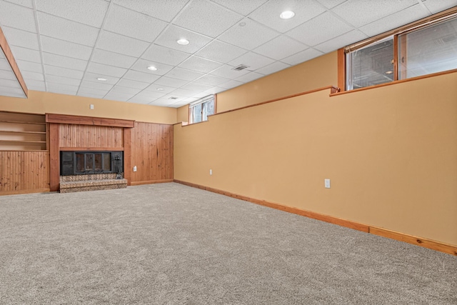 3879 Polk St NE, Columbia Heights, MN 55421 - basement with a fireplace, wood walls, baseboards, and carpet floors