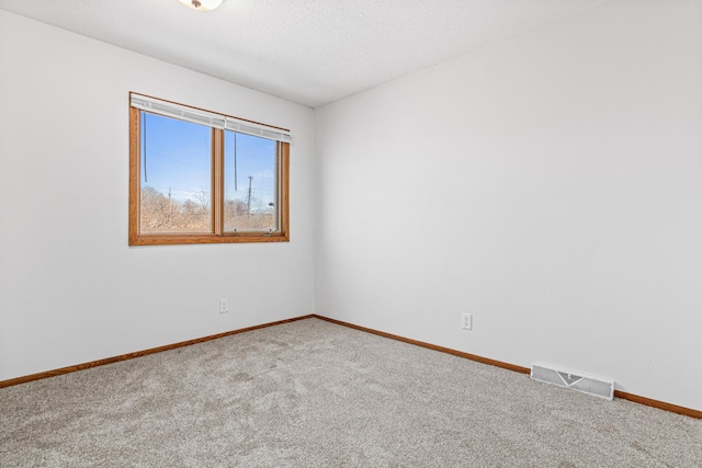 3879 Polk St NE, Columbia Heights, MN 55421 - carpeted spare room featuring visible vents and baseboards