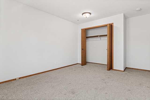 3879 Polk St NE, Columbia Heights, MN 55421 - unfurnished bedroom with a closet, carpet flooring, and baseboards