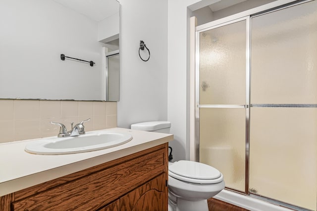 3879 Polk St NE, Columbia Heights, MN 55421 - full bath featuring toilet, vanity, a shower stall, and backsplash