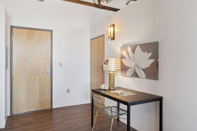 office area featuring visible vents and wood finished floors