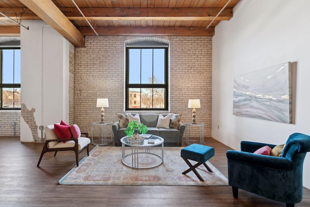 living room with wooden ceiling, wood finished floors, and a healthy amount of sunlight