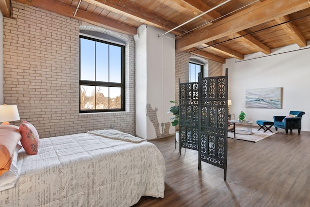 bedroom with wood ceiling, brick wall, and wood finished floors