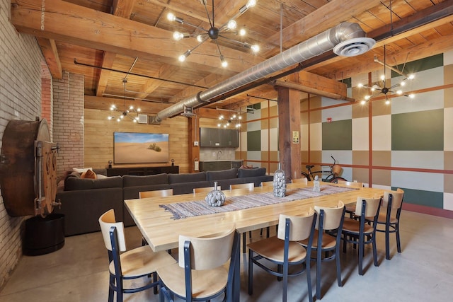 dining space featuring wooden ceiling, visible vents, finished concrete flooring, and beam ceiling