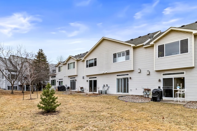 rear view of house with a patio area and central air condition unit