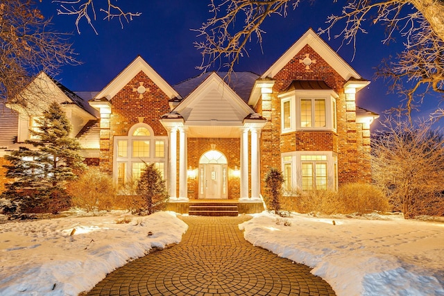 view of front of home featuring brick siding