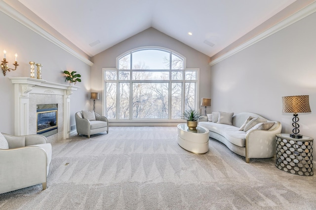 living area with light carpet, visible vents, high vaulted ceiling, and a tile fireplace