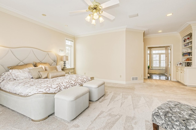 bedroom featuring light carpet, crown molding, visible vents, and baseboards