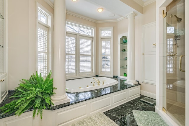 bathroom featuring marble finish floor, decorative columns, a tile shower, and crown molding