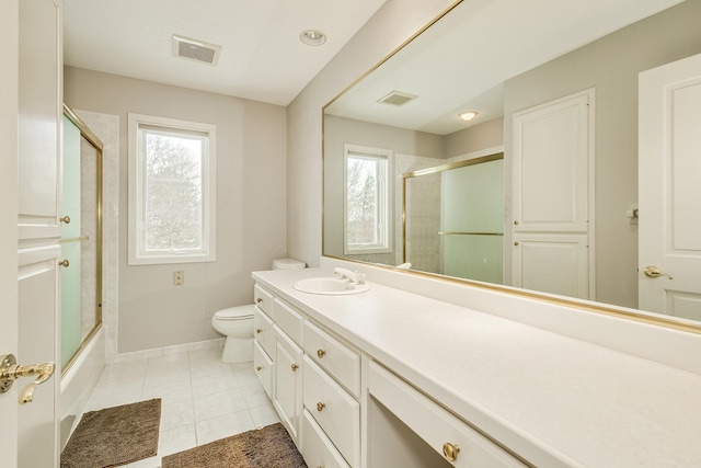 bathroom with toilet, tile patterned flooring, visible vents, and baseboards