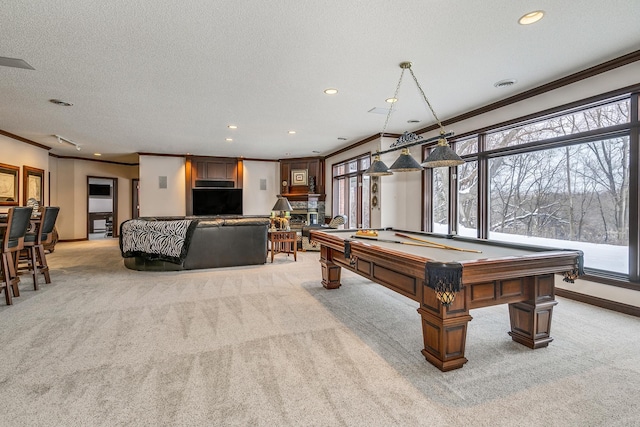 game room featuring ornamental molding, light carpet, a textured ceiling, and baseboards