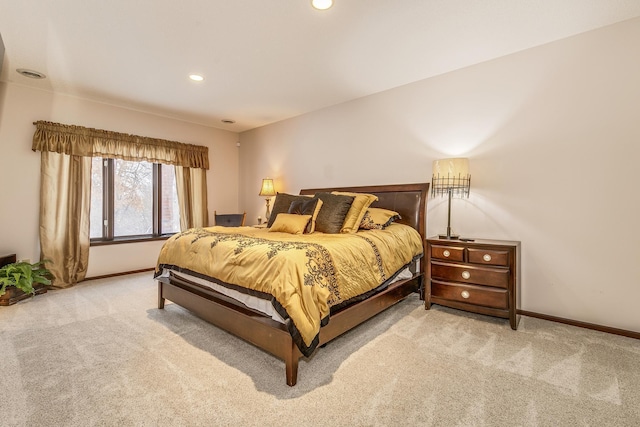 bedroom with baseboards, recessed lighting, and light colored carpet