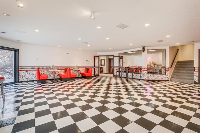 building lobby with stairway and a sink