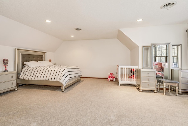 bedroom with light colored carpet, visible vents, vaulted ceiling, and recessed lighting