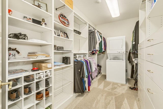 spacious closet with stacked washing maching and dryer and light colored carpet