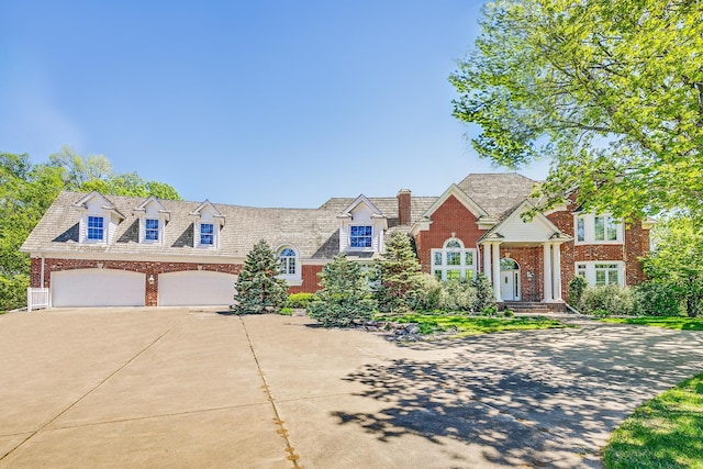 4680 152nd Ct NW, Ramsey, MN 55303 - view of front of house with brick siding, driveway, and a garage