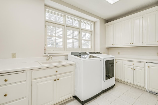 4680 152nd Ct NW, Ramsey, MN 55303 - laundry room featuring washer and dryer, cabinet space, and light tile patterned flooring