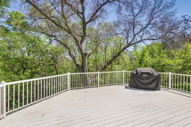 4680 152nd Ct NW, Ramsey, MN 55303 - wooden terrace with a grill and a wooded view