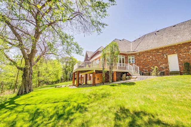 4680 152nd Ct NW, Ramsey, MN 55303 - back of house featuring brick siding, a deck, and a yard