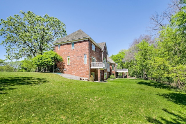 4680 152nd Ct NW, Ramsey, MN 55303 - view of home's exterior with a lawn, brick siding, and a deck