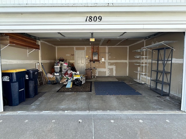 garage with electric panel and a garage door opener