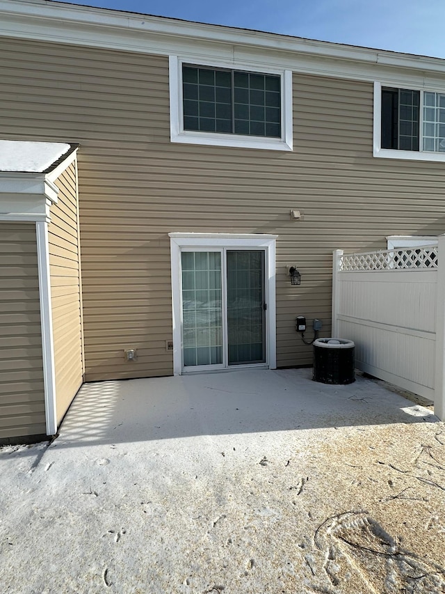 back of house featuring a patio area and fence