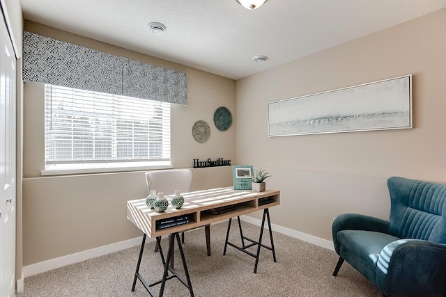 office featuring visible vents, baseboards, and carpet flooring