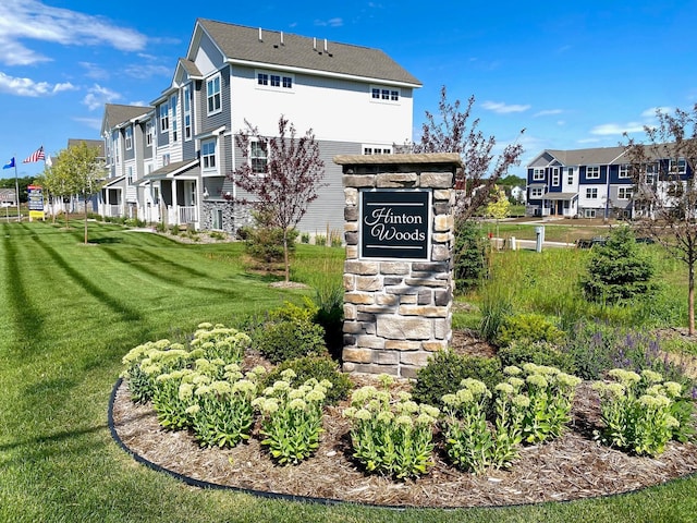 view of community with a residential view and a yard