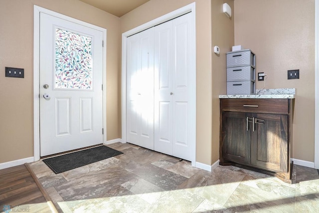 entrance foyer with baseboards