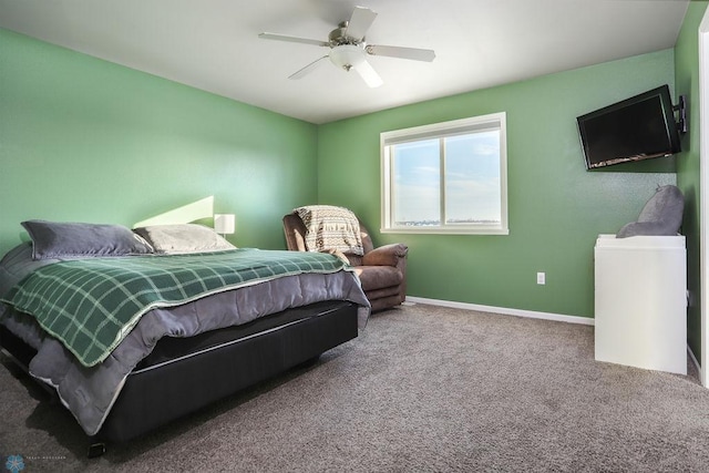 bedroom featuring ceiling fan, carpet flooring, and baseboards