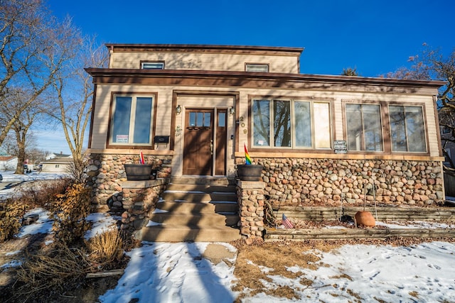 view of front facade featuring stone siding