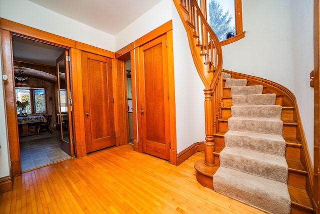 interior space featuring light wood-type flooring and stairway