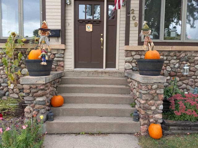 entrance to property with stone siding