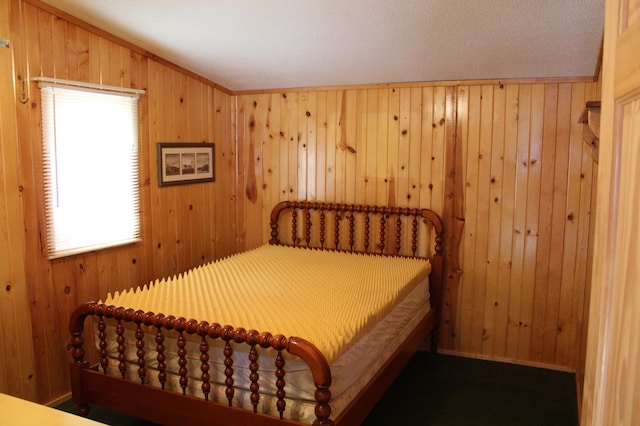 bedroom featuring wood walls