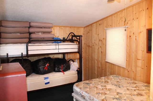 bedroom with vaulted ceiling and wooden walls