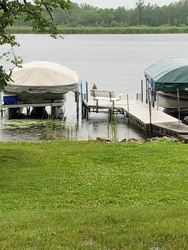 view of dock with a water view and boat lift