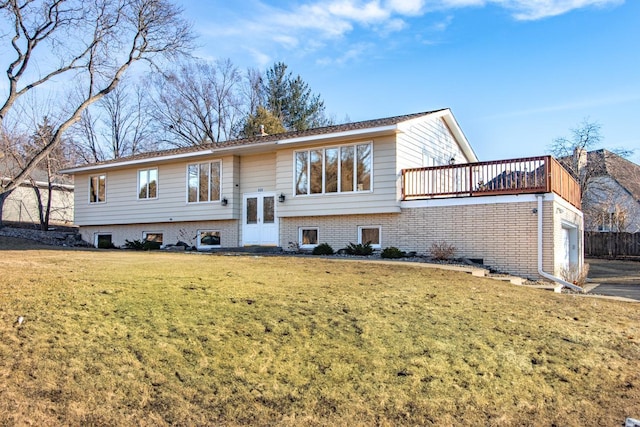 raised ranch with an attached garage and a front lawn